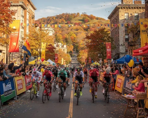 A cycling race taking place on a city street lined with colorful autumn trees. Cyclists race as spectators cheer from both sides. The festive scene includes banners, flags, and confetti in the air, with historic buildings and a scenic hill in the background.